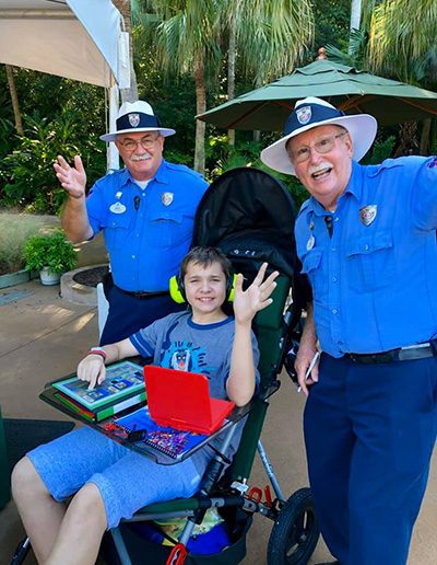 Child in a stroller marked as a wheelchair at Disney World