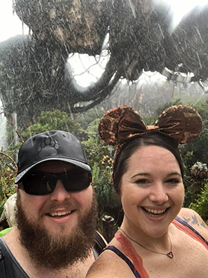 couple in the rain enjoying Disney World
