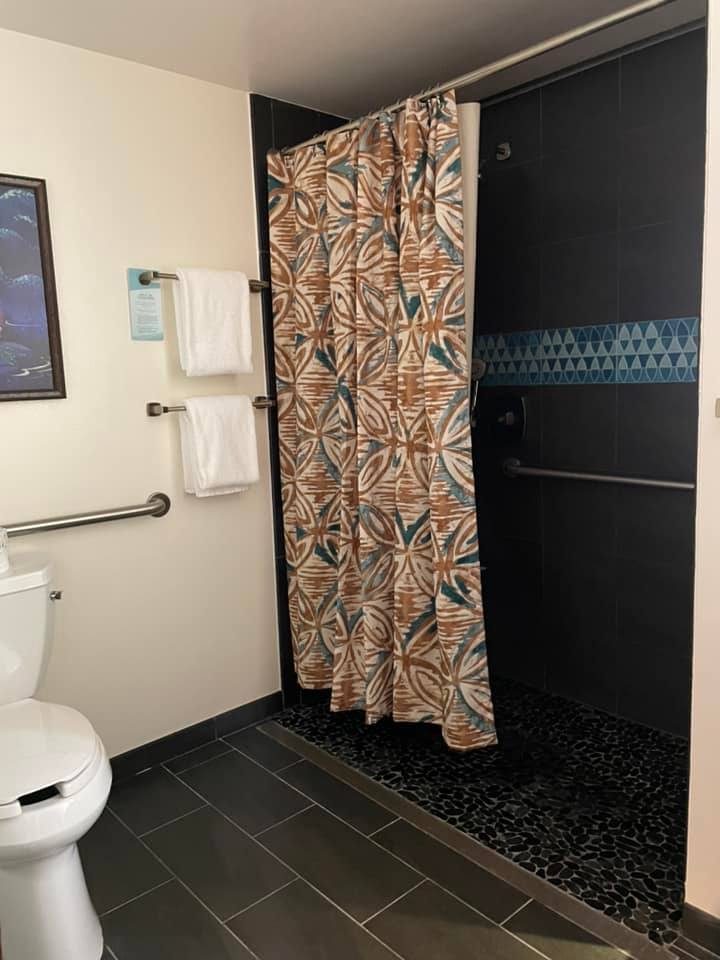 Handicapped accessible bathroom with a roll-in shower in a Deluxe Villa at Disney's Polynesian 